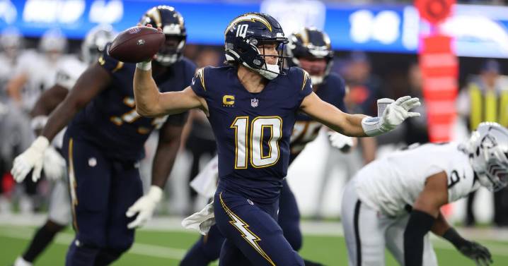 Chargers sweep Raiders, but Justin Herbert's hand injury could complicate playoff push