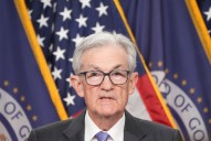 Federal Reserve cuts key rate, sees healthier economy next year