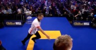 Chinese darts ace falls over on Ally Pally stage and the tear