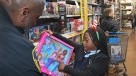 See photos as kids, Cocoa officers team for Shop with a Cop