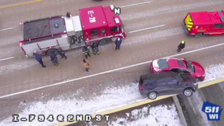 SUV hangs over guard rail of Milwaukee highway