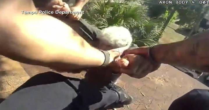 Tampa police rescue elderly man dangling from roof: "I'm glad somebody's got me"