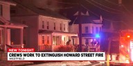 Crews work to extinguish Howard Street fire