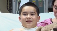 Boy, 8, electrocuted after his chain necklace got caught between phone charger while he slept