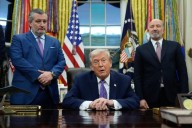 Trump signs order to fight state AI laws 