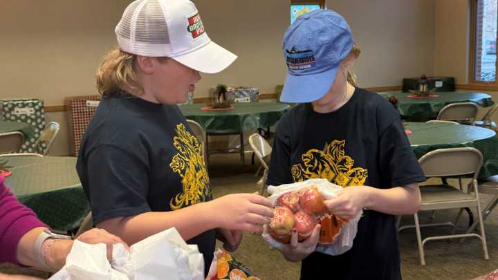 Scouts from Ida volunteer to serve food at local soup kitchen