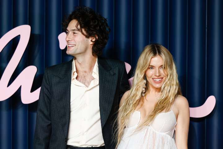 Sienna Miller pregnant with third child, debuts bump at 2025 Fashion Awards