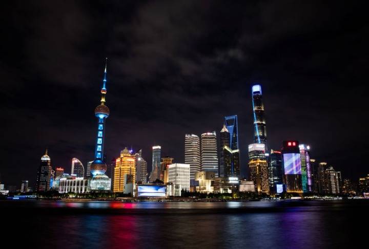 IMF urges China to speed up structural reform, raises growth forecasts