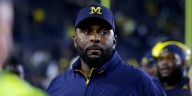 Fired Michigan football coach Sherrone Moore is charged with 3 crimes, including home invasion and stalking
