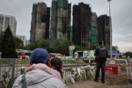 ‘Highly traumatised’: Hong Kong presses ahead with elections after deadly fire