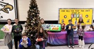 Team of Heritage Middle students supporting local children and families with gift, food drives