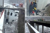 Truck driver rescued after dangling 100-feet in the air off West Virginia highway