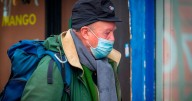 Professor identifies flu strain behind UK surge as NHS chief advises masks