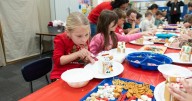 Deer Ridge Elementary kindergarten students decorate gingerbread houses