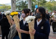 Hong Kong fire probe reveals unsafe netting as public mourns and government stifles dissent