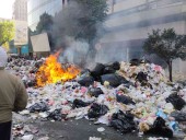 Personal de limpia de CdMx protesta y quema basura en Fray Servando