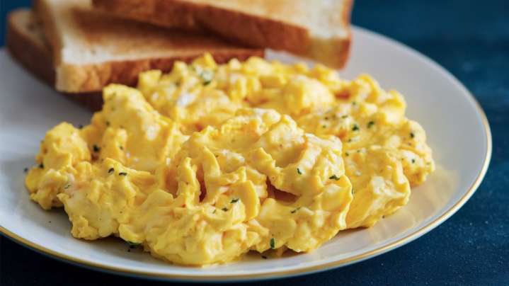 The Cheap Ingredient That Makes Scrambled Eggs Taste Extra Decadent