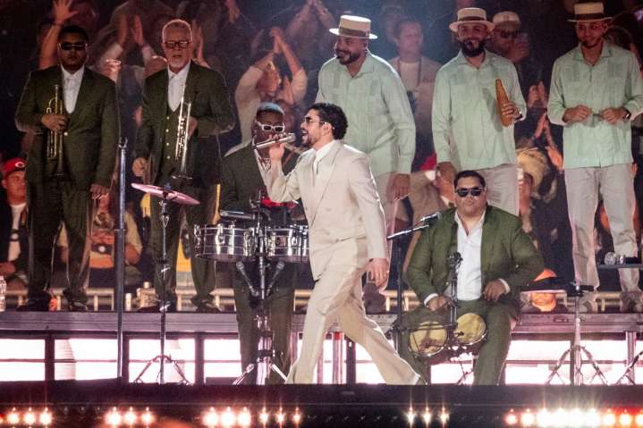 Bad Bunny Slips & Falls During Concert, But His Fans Keep the Show Going for Him