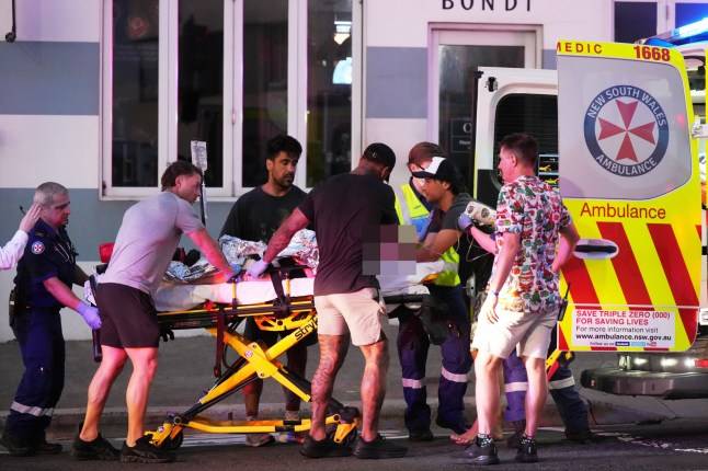 Moment bystander disarms Bondi beach gunman before firing back at him