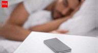 Sleeping next to your phone may cause brain cancer, fertility issues, and other hidden health risks, experts warn about