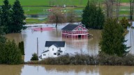 Washington state faces historic floods that have washed away homes and stranded families