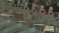New robots inside Boise's USPS facility help process and handle packages during holiday rush