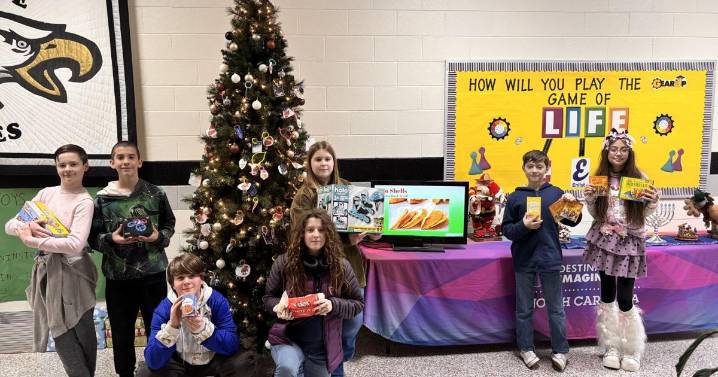 Team of Heritage Middle students supporting local children and families with gift, food drives