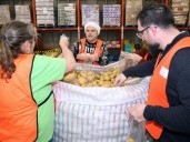 Annual challenges sees mayor, councillors bag potatoes at Calgary Food Bank