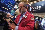 Wall Street sets records despite AI bubble worries