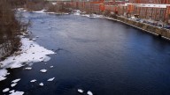 Person missing in Merrimack River, search will resume Thursday