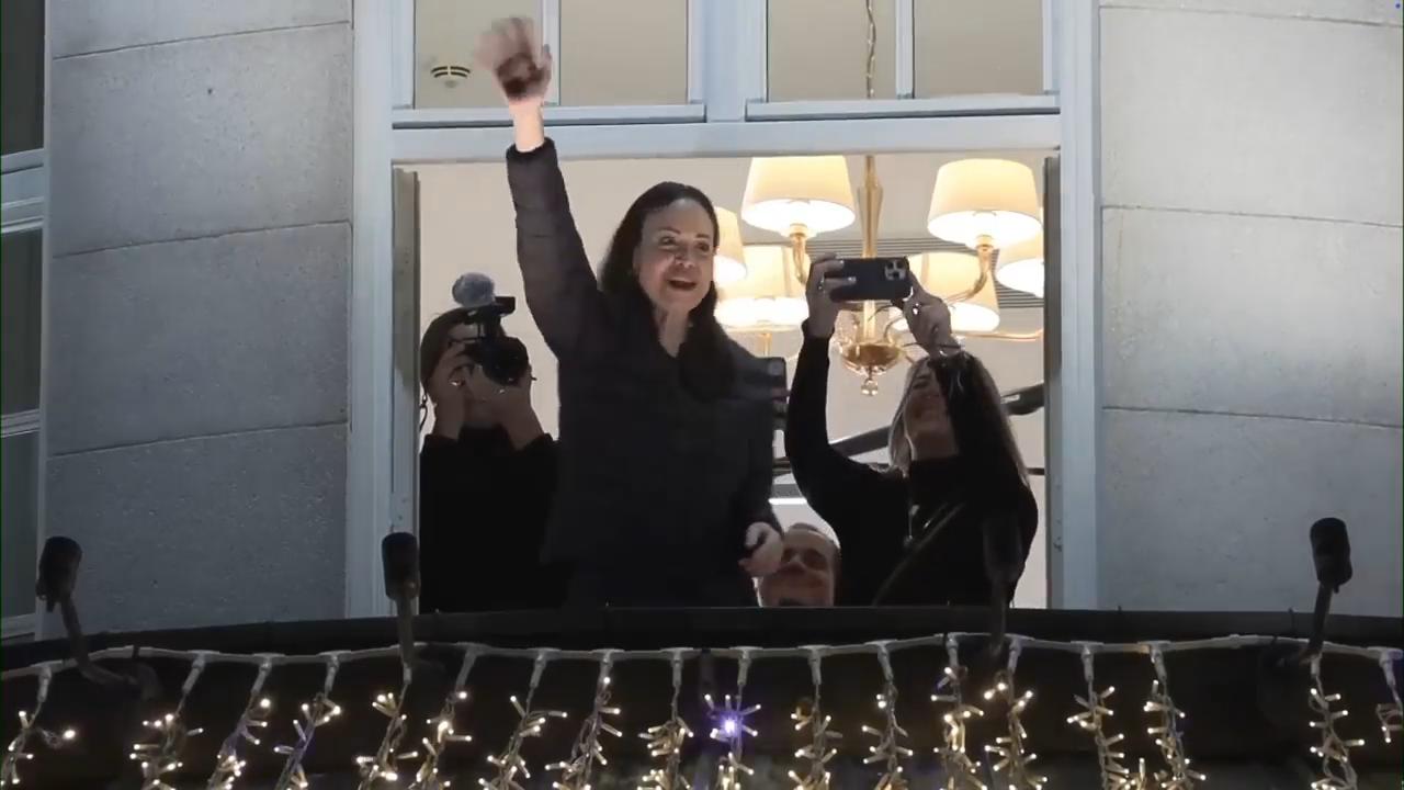 Nobel Peace Prize winner, Venezuela's Machado, waves to crowd from hotel balcony in Oslo