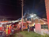 Emergency crews battle first-alarm row home fire in Harrisburg