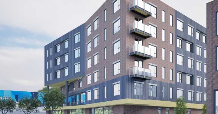 New plan for former Elm St. diner site reduces number of units, keeps billboard visible