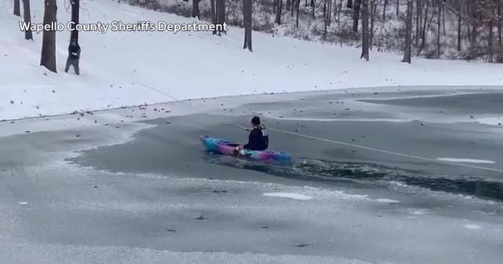 Quick-thinking rescuers save freezing dog from icy pond