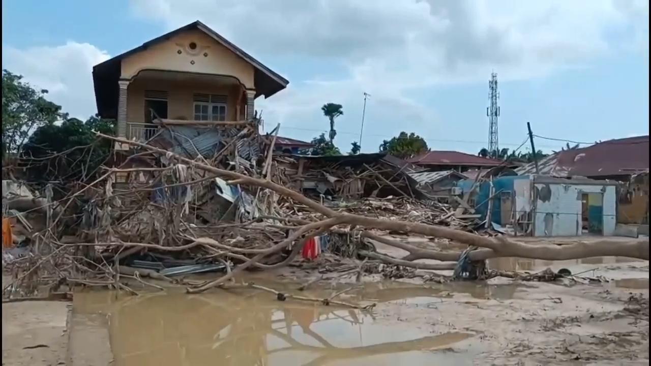Damaged roads and debris slow relief operations after deadly floods in Indonesia