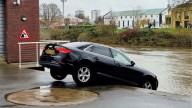 Moment Audi left dangling precariously over River Severn despite nearby warning sign