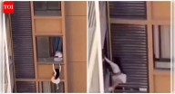'Falling' for him: Mistress dangles from 10th-floor balcony in China after lover’s wife returns home — Watch