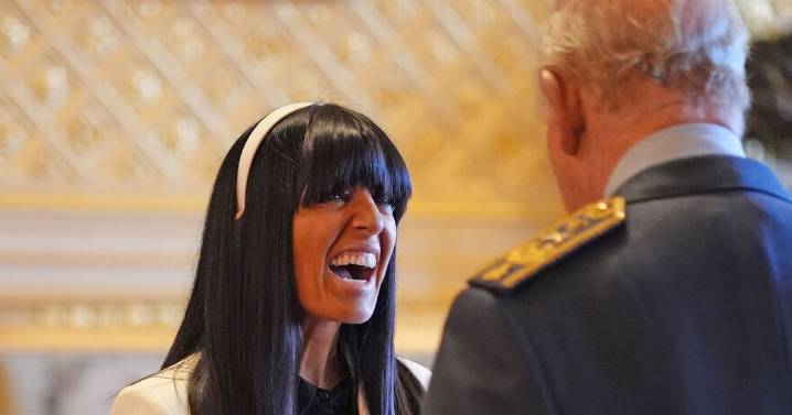 Claudia Winkleman awarded MBE by King Charles as proud husband watches on