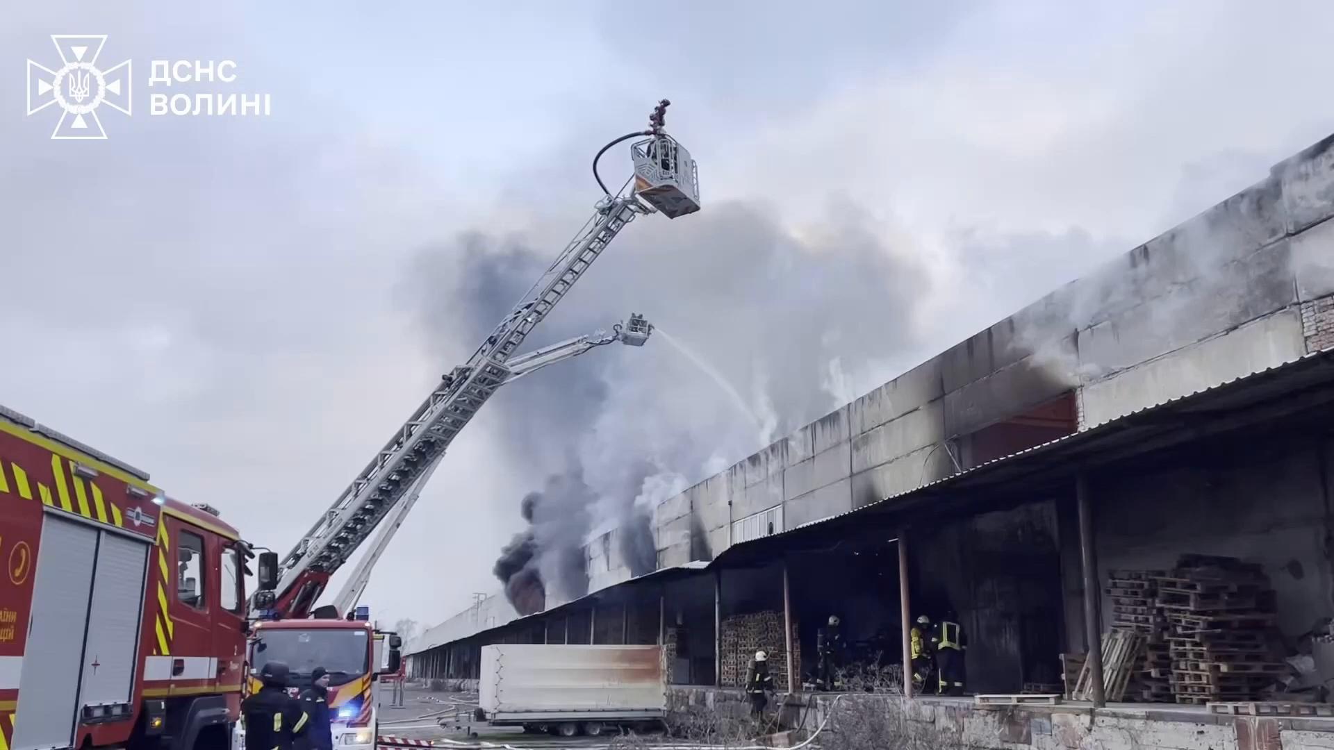 Firefighters tackle a blaze in Lutsk after Russia attacks Ukraine with drones and missiles