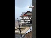 House collapses, road crumbles in Indonesia flooding