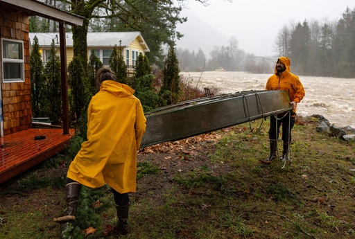 Record flooding threatens Washington as more heavy rain pounds the Northwest