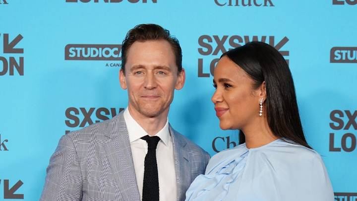 Tom Hiddleston makes rare red carpet appearance with fiancée Zawe Ashton in sweeping red gown