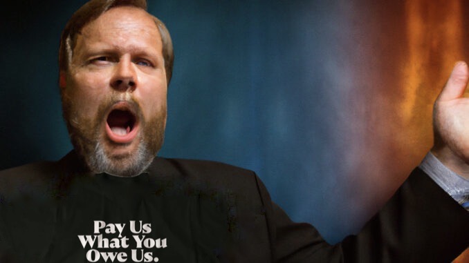 Mennonite Pastors Make Statement With ‘Pay Us What You Owe Us’ T