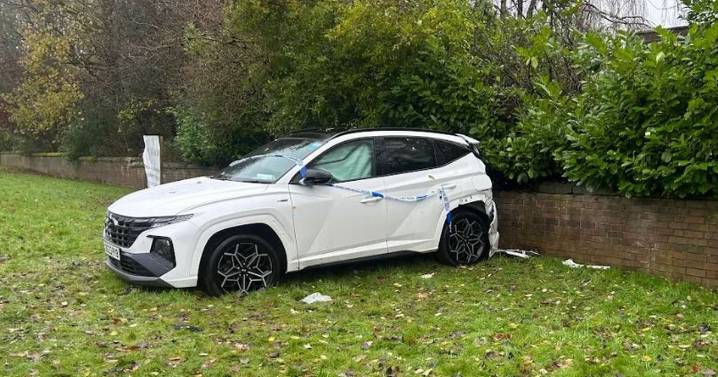 Police tape around car after Carmountside Crematorium crash