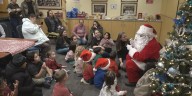 Santa meets deaf or hard of hearing children using American Sign Language