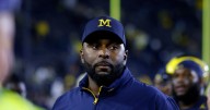 Fired Michigan football coach charged with home invasion and stalking