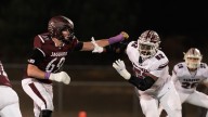 Caravel football stars sign scholarships with Miami, James Madison
