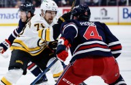 Bruins lose two players to injuries