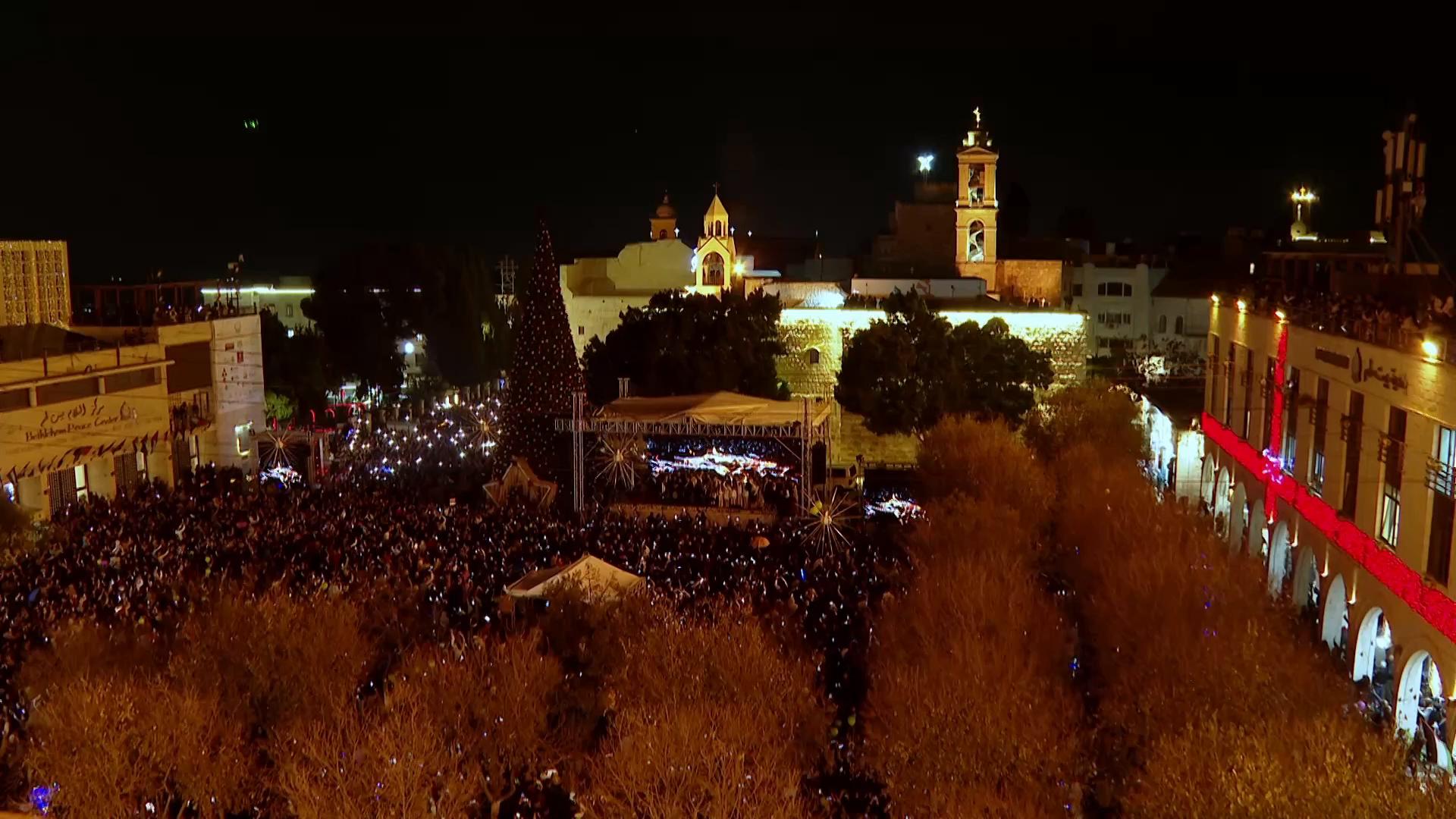 Hundreds flock to see Bethlehem Christmas tree lit up for first time since start of Gaza war