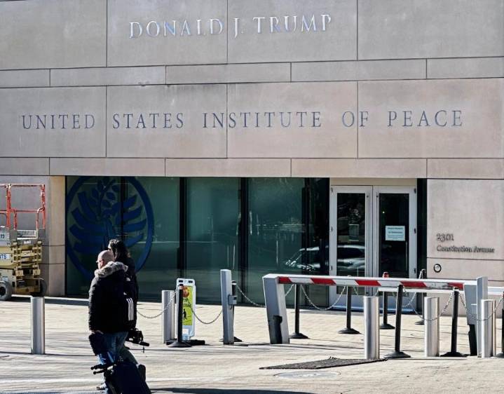 Trump is fighting the Institute of Peace in court. Now, his name is on the building